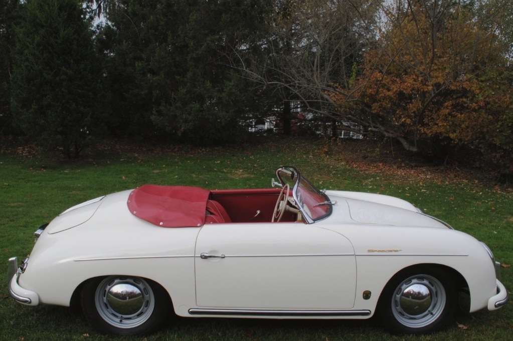 Classic white 1957 Porsche 356A Speedster with rebuilt powertrain, verified color code, and pristine red interior.