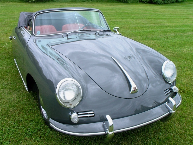 Meticulously refinished Slate Grey 1961 Porsche 356B Cabriolet with vibrant red interior, ideal for collectors of vintage European icons.