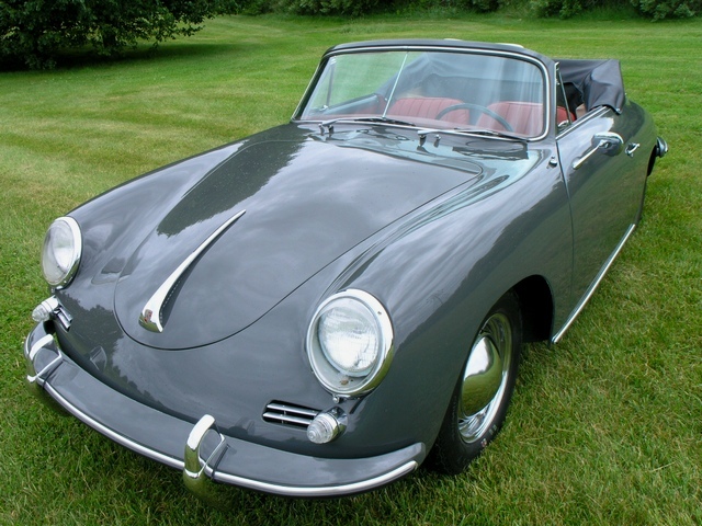 Reimagined with care, this 1961 Porsche 356B Cabriolet in Slate Grey over red interior delivers factory-authentic elegance and collector value.