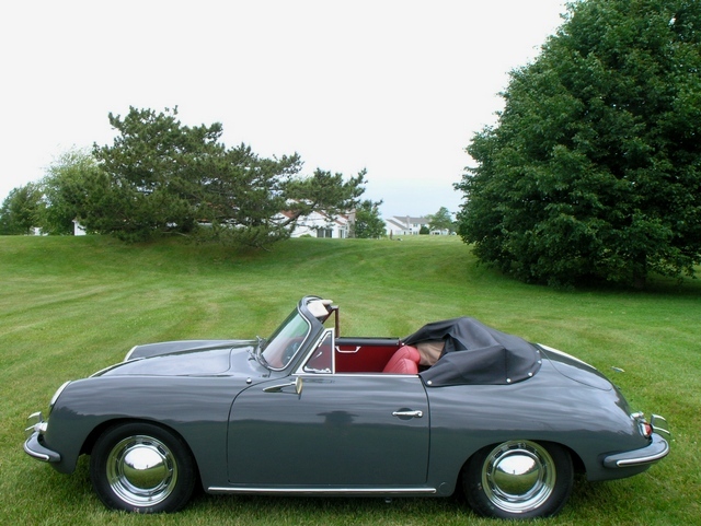 A rare 1961 Porsche 356B Cabriolet restored to factory Slate Grey with red leather, tailored for collectors of precision-engineered classics.
