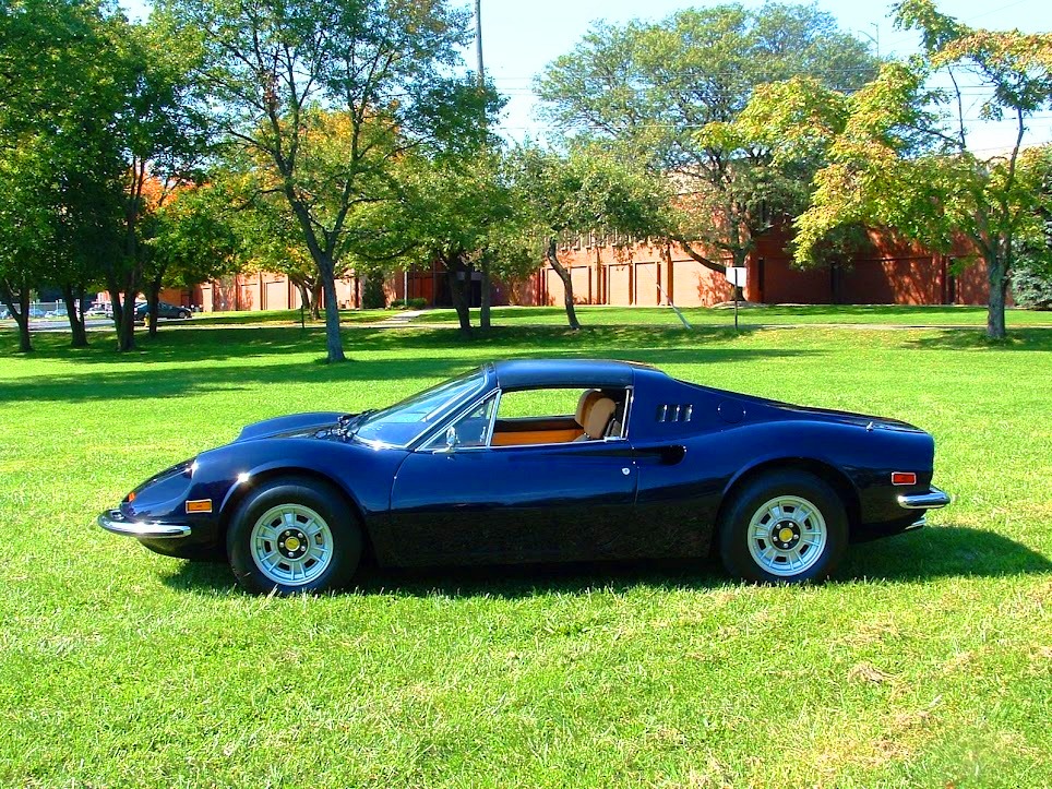 Carefully restored 1974 Ferrari 246 GTS Dino with authentic mouse fur dash, blue finish, and detailed brake and chassis plating throughout.