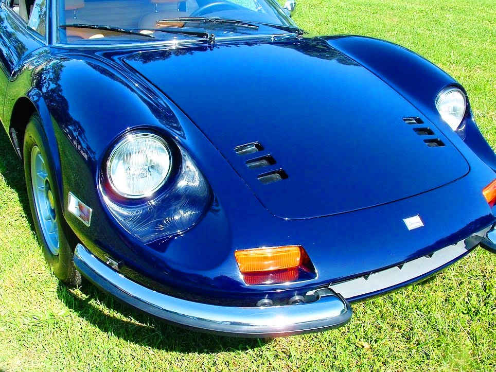 Museum-display-ready 1974 Ferrari 246 GTS Dino convertible in blue with tan Daytona seats, factory dash trim, and professionally detailed suspension.